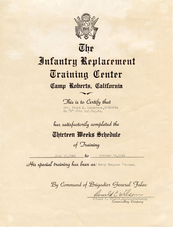 A yellowed parchment piece of paper that is a training certificate recognizing Floyd Lindstrom's time in the Infantry in 1942.