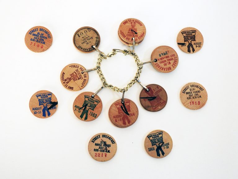 Pikes Peak or Bust Street Breakfast Token Bracelet, ca. 1965. Generously donated by Col. Walden A. Sundell, 2002.110.8