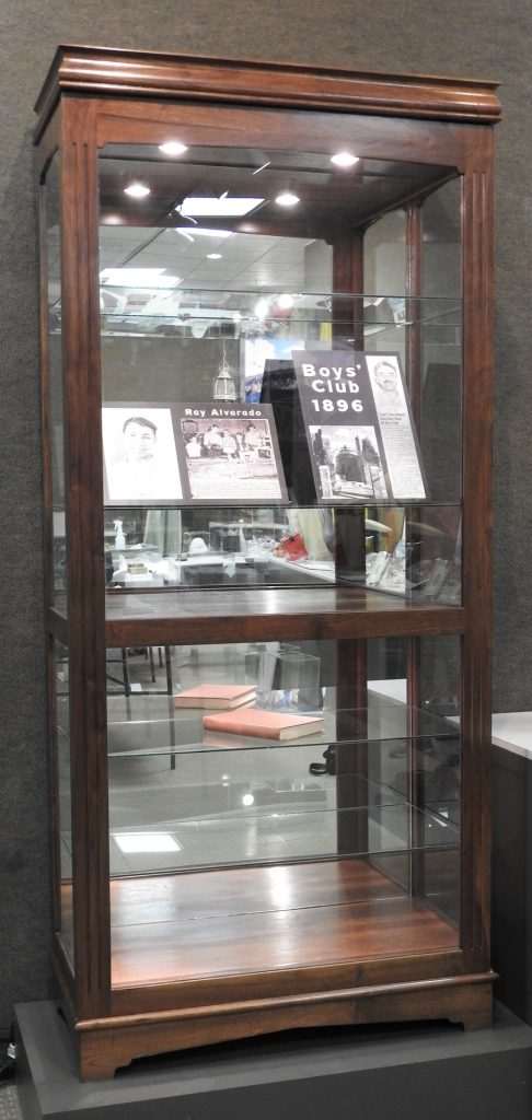 Display Cabinet Created by Ray Alvarado, 2004. Generously donated by Ray Alvarado, 2020.23.1. Manual of Boys Club Operation, 1947, CSPM Collection, S2016.1.89
