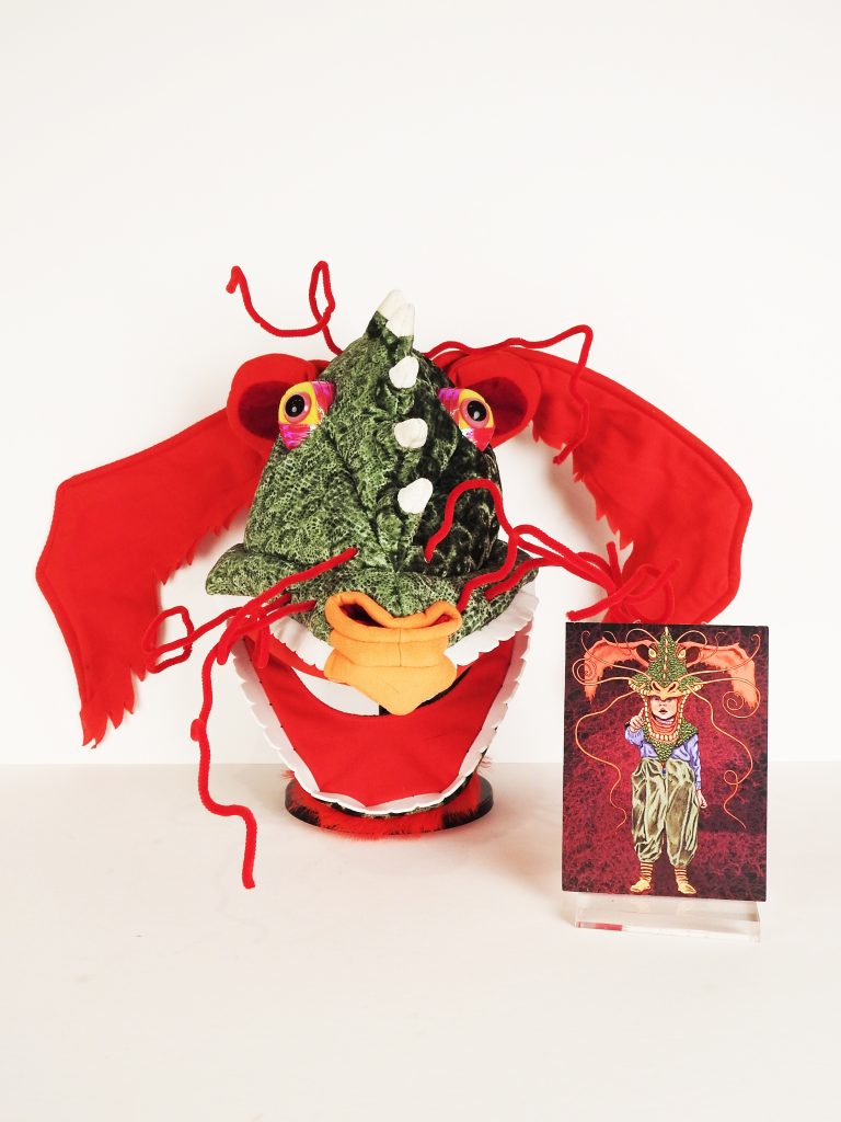 Imagination Celebration Dragon Mask, 2005, Michael Hague Dragon Card, 2005, Mary Mashburn’s Magical Fairy Wand, Generously Donated by Deborah Thornton, Imagination Celebration. 2020.65.1