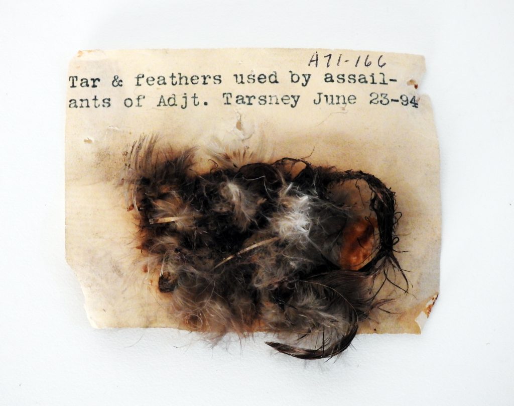 Tar and Feather remnants from kidnapping and assault of General Thomas J. Tarsney, June 1894. Generously donated by Oren Boling, 71-166-1, 2;