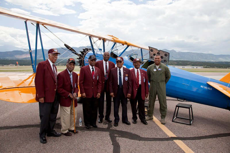 The Airmen with General Clark standing with the Spirit of Tuskegee after a full day of stories, interviews, and conversations with the cadets at the Air Force Academy in Colorado Springs, CO. (Photo courtesy of NMAAHC)