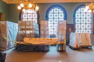 A large room in the historic 1903 El Paso County Courthouse. In the background you see shelves covered in tyvek.