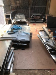 Stacks of decommissioned HVAC equipment and metal ducts prior to its removal from the Fourth Floor.