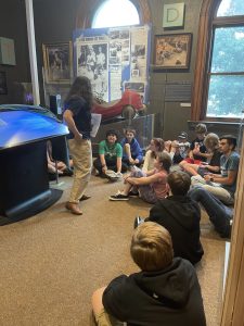 Presenting to our Museum Discovery Summer Camp in the "Story of Us" exhibit