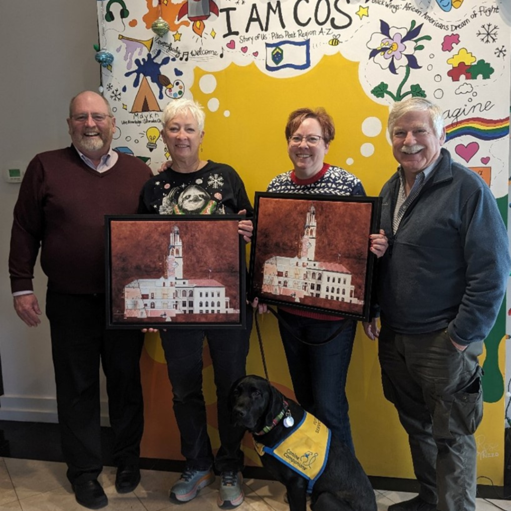 From Left to Right: Matt Mayberry, Museum Director, Sue Laabs, Laurel Prud’homme, and Sam Eppley, 2024 Board President in front of the I AM COS selfie mural at the CSPM Annex.