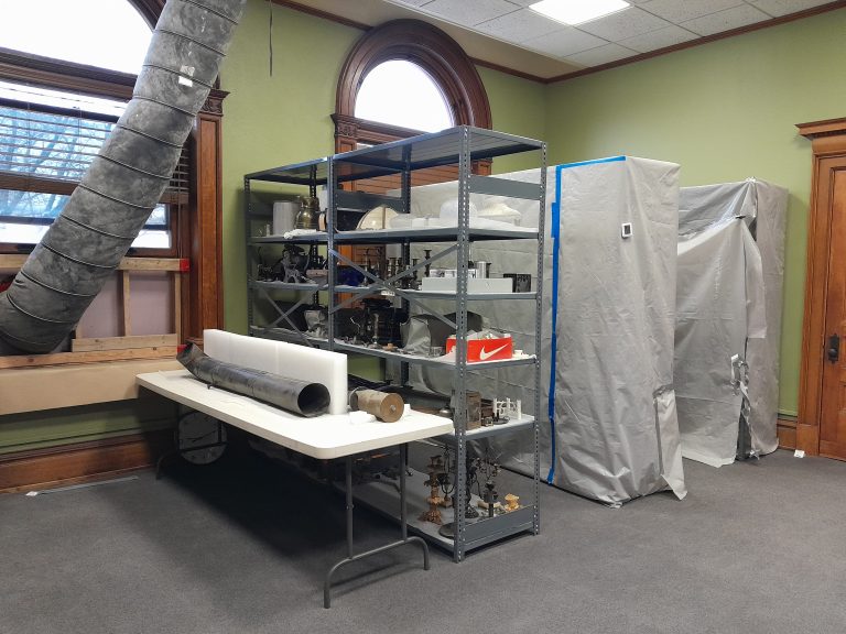 Shelving in the CSPM Education Room holding artifacts from the CSPM collections.