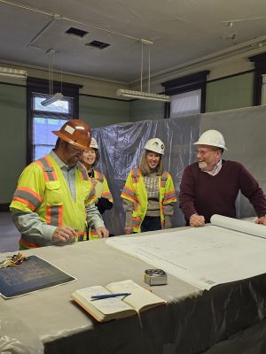 City of Colorado Springs Project Manager Jake Butterfield and CSPM Staff Kelly Murphy, Leah Davis Witherow and Matt Mayberry looking over plans for the Southwest Collections Storage space.