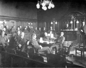 A89-84-3 Group of Men Sitting in Courtroom at the El Paso County Courthouse (1906), from the CSPM Collections.