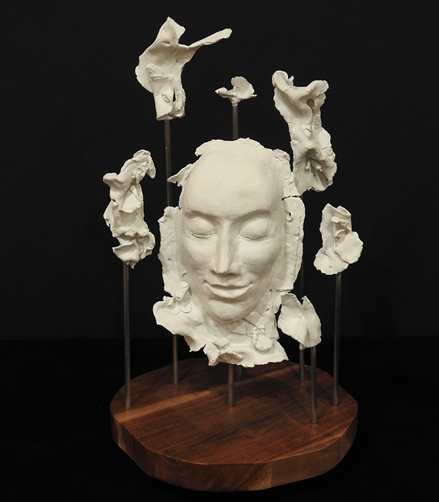 Pulling Myself Together, Mixed Media , Suzy Hunt Gardner, Sculpture of a figure’s face, with several disjointed plaster fragments haloing.