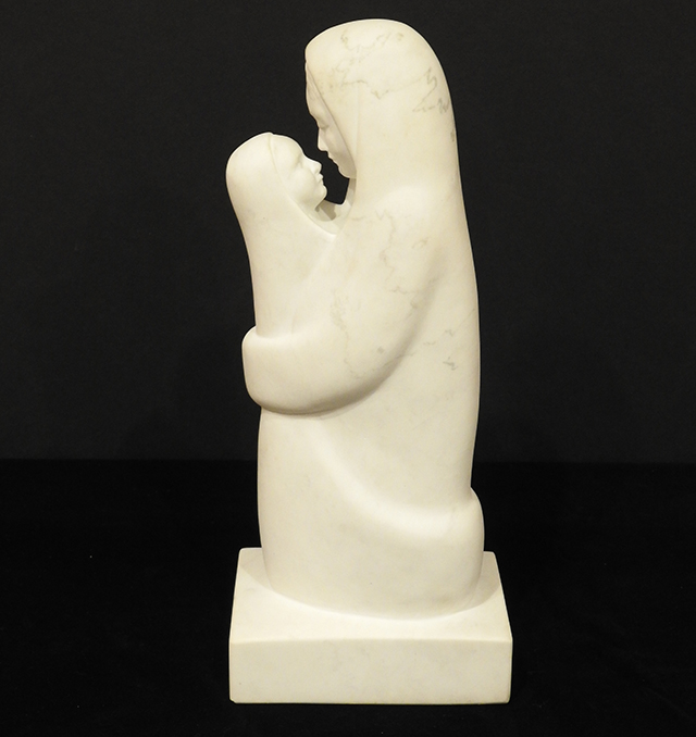 Statue of a woman holding child.