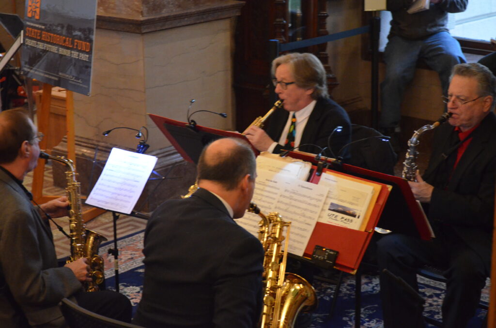 Four musicians playing in the museum.