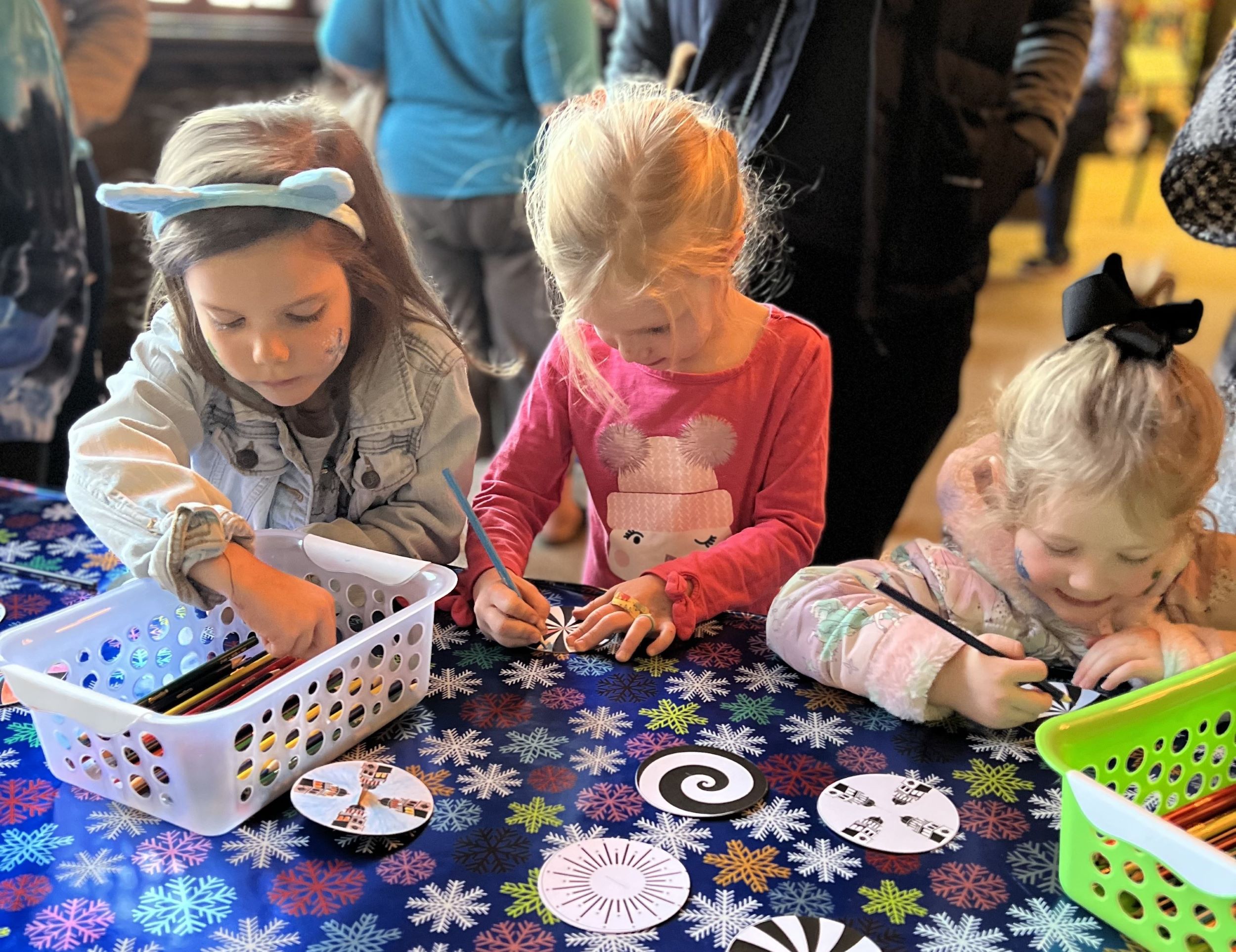 A group of children making holiday crafts