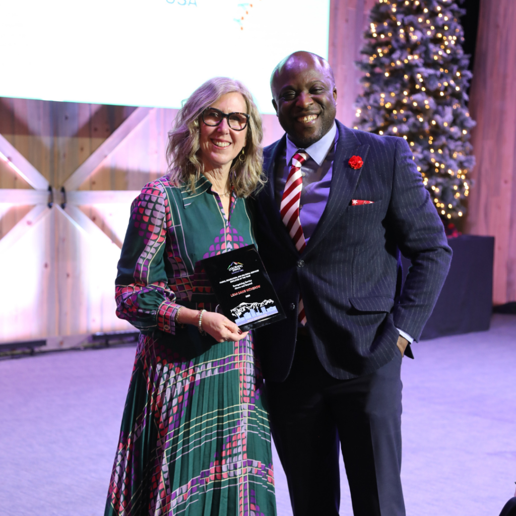 Leah Davis Witherow accepts PCRS employee of the year award from Mayor Yemi